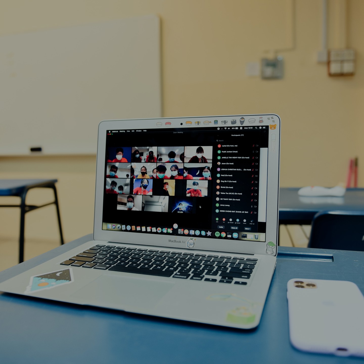 Laptop and phone with zoom call
